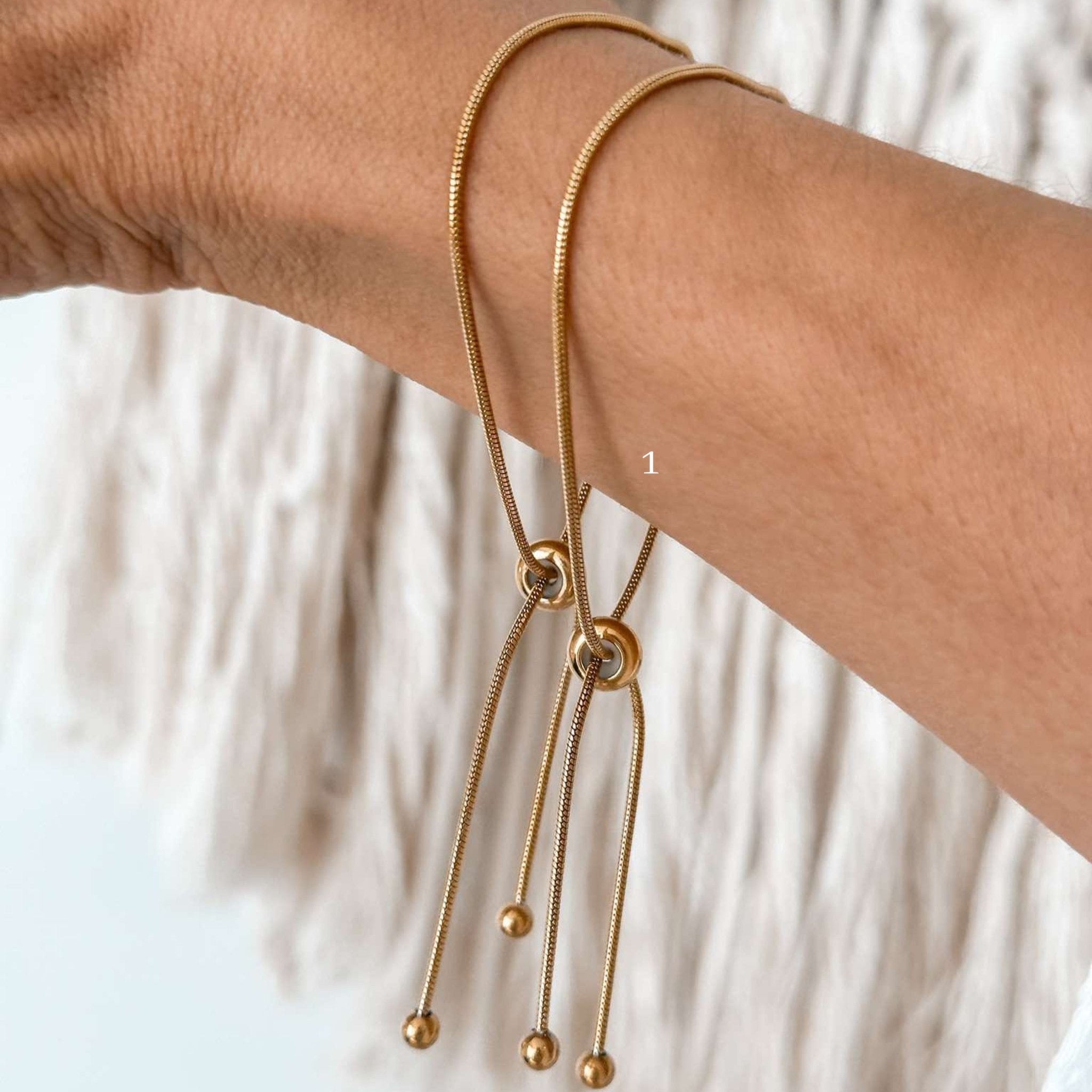 Minimalist box chain bracelet with sliding closure, gold plated and waterproof.