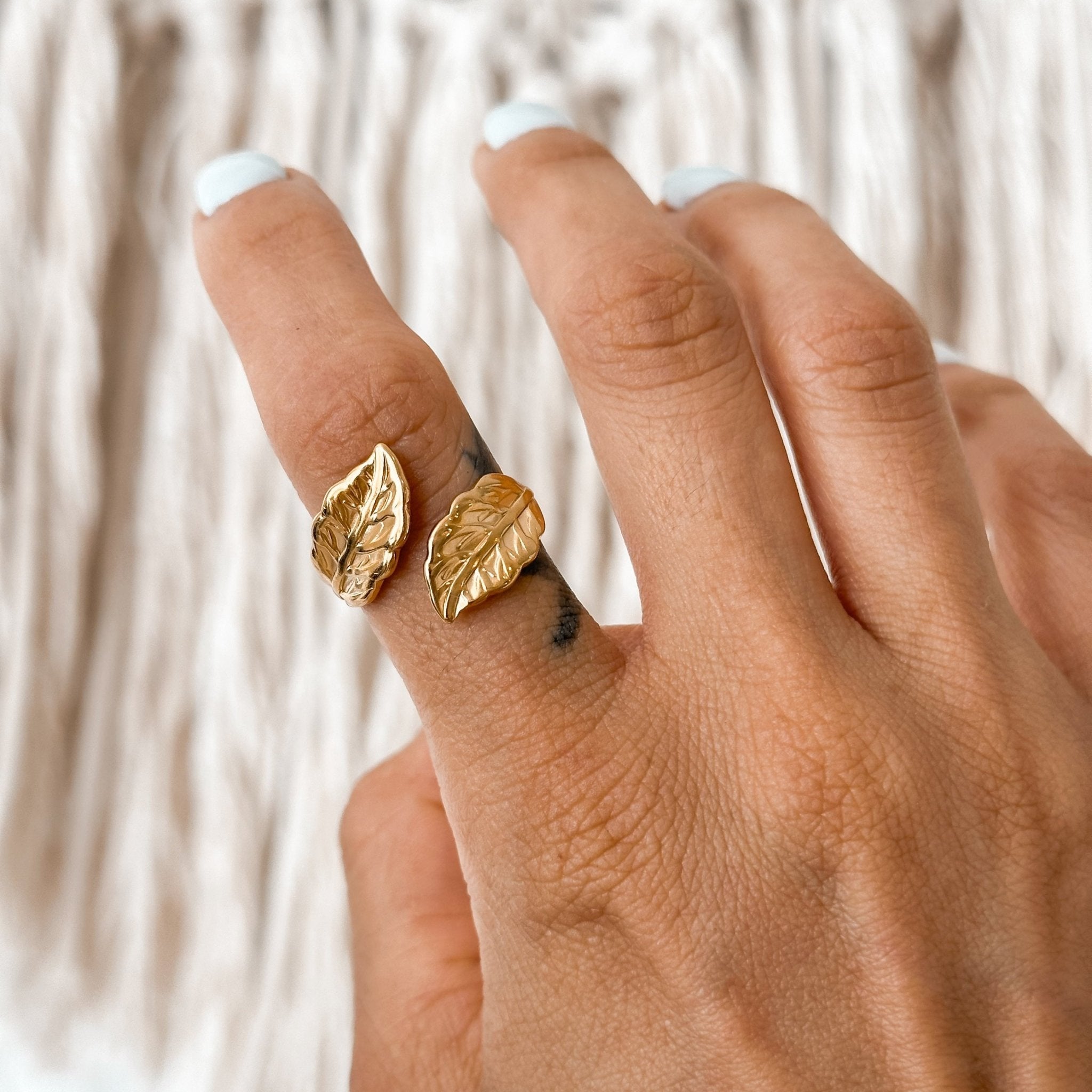 Gold leaf wrap ring worn on hand – adjustable open ring with boho-natural vibe, perfect for layering