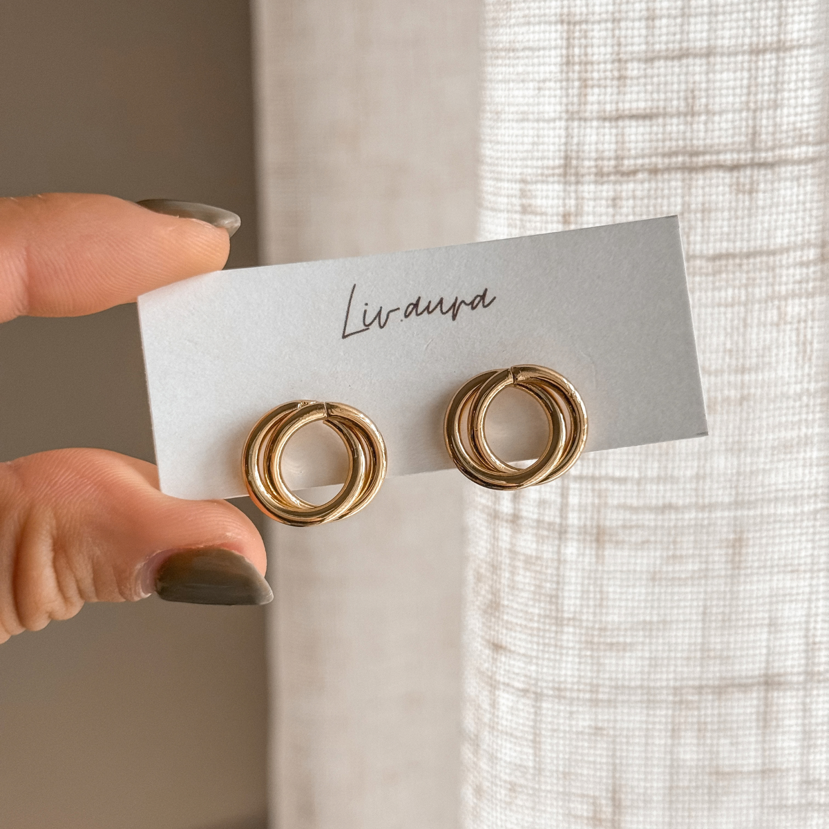 Gold circle stud earrings on a Liv Aura earring card – Liv Aura