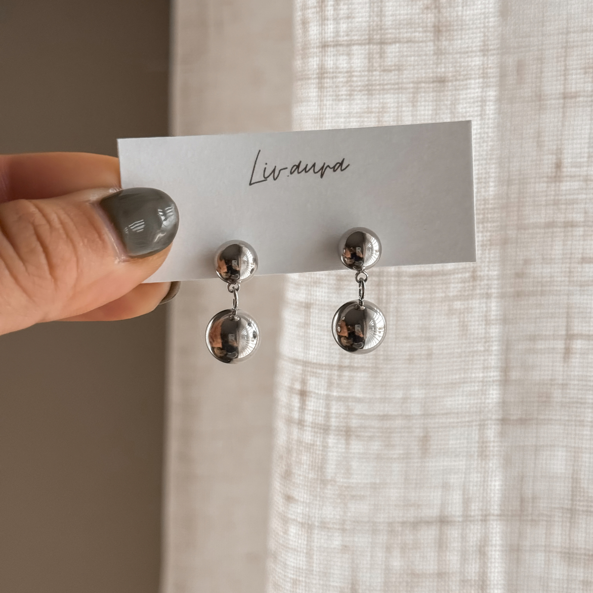 Silver double ball drop earrings on a Liv Aura earring card – Liv Aura