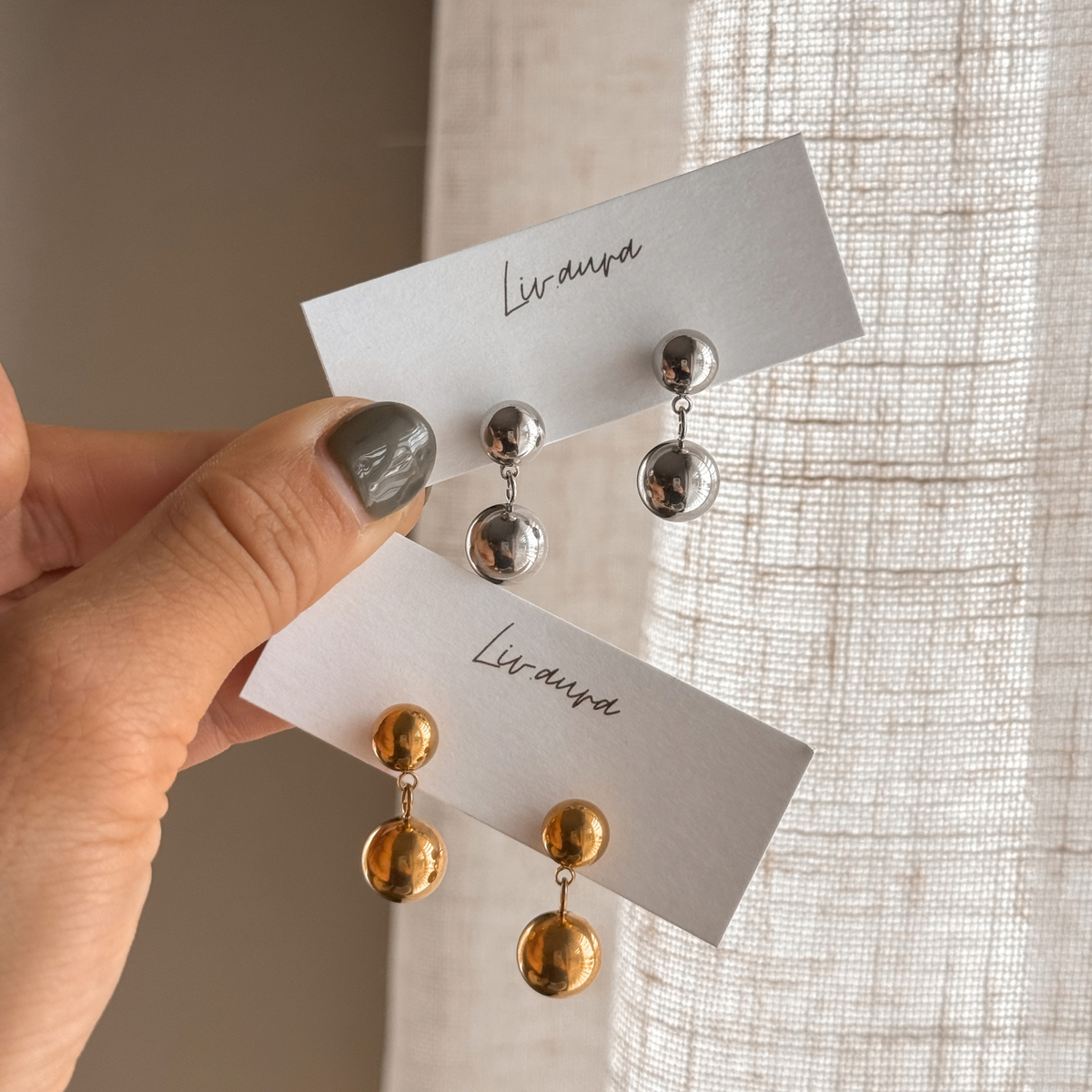 Double ball drop earrings in gold and silver on Liv Aura earring cards – Liv Aura