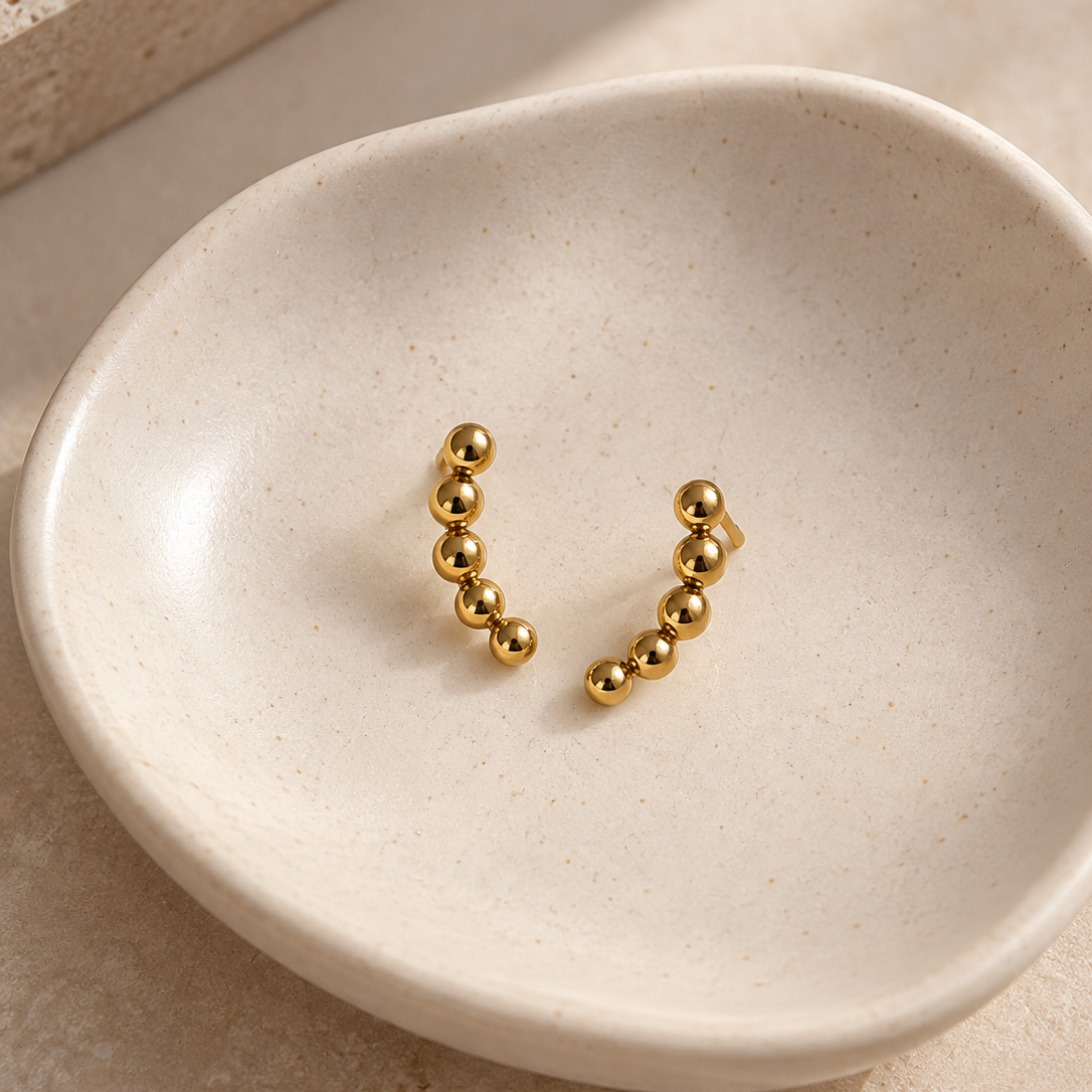 Ear Climber Earrings on a ceramic dish – Liv Aura