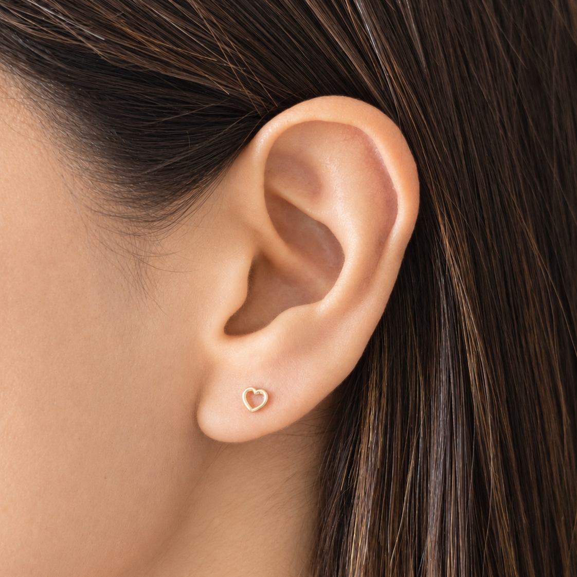 10K & 14K Solid Gold Open Heart Stud Earrings worn on the ear – Liv Aura