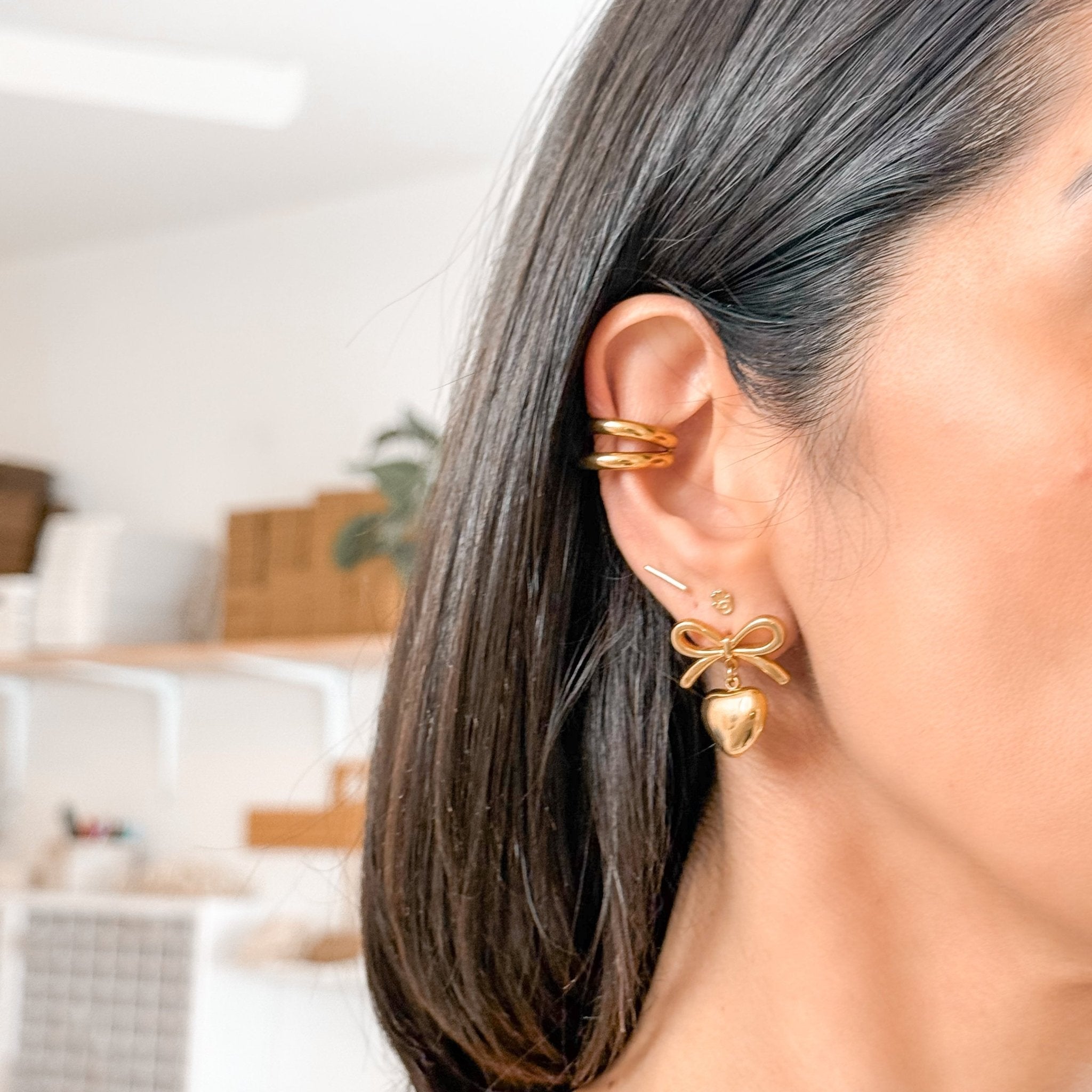 18K Gold Double Band Ear Cuff styled with other jewelry for a layered ear stack