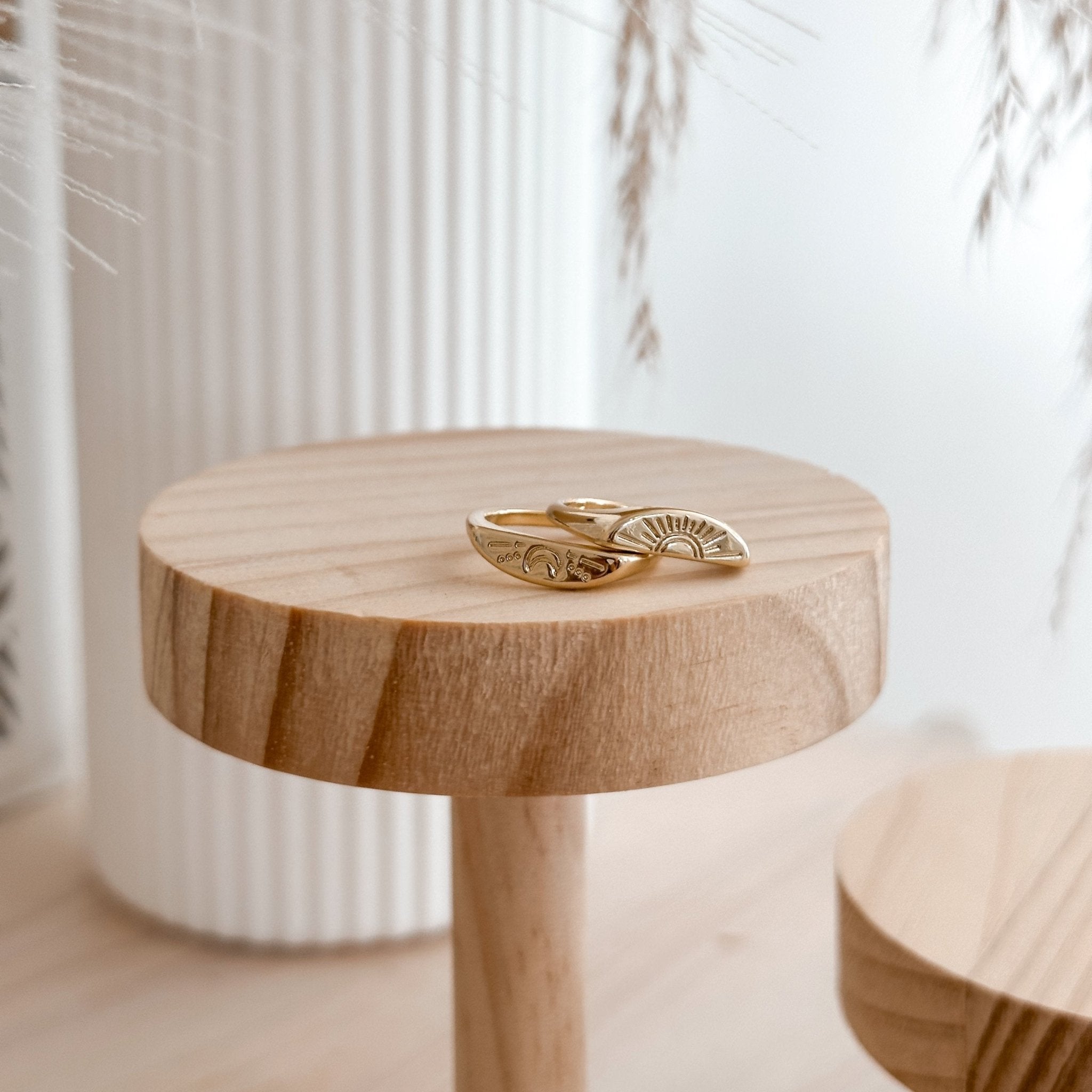 Moon & Sun Ring Set on wooden display – minimalist and meaningful jewelry piece.