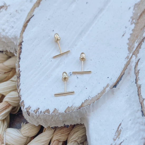 These Gold Bar stick earrings are simple and elegant. The gold setting makes these earring a great addition to your jewelry collection.