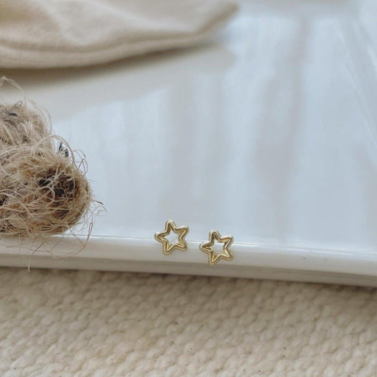 Load image into Gallery viewer, These minimalist screw-back star stud earrings are the perfect gift! Show off your unique personality with these gold bit earrings. 

