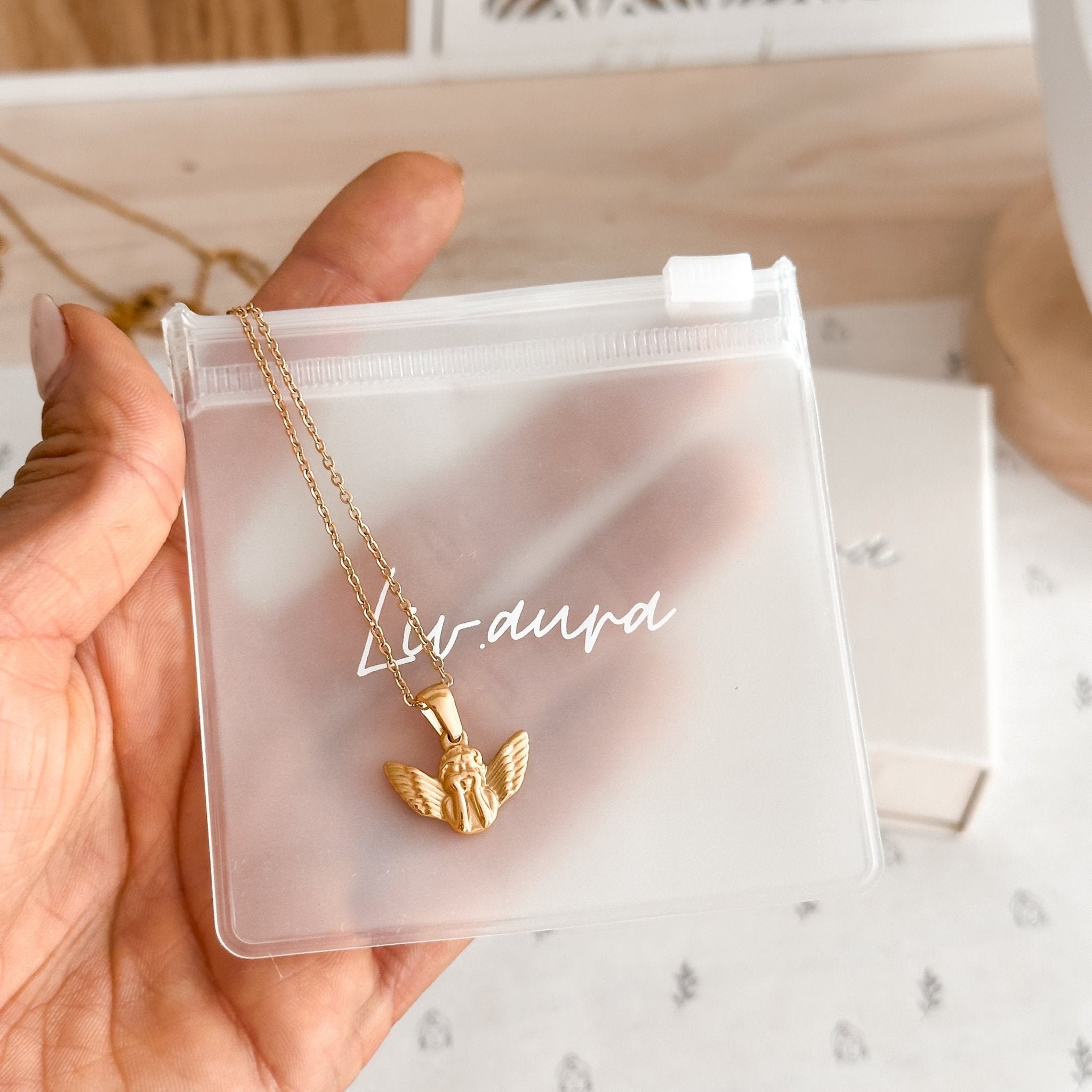 18K Gold Angel Necklace beautifully packaged in a delicate, eco-friendly gift bag