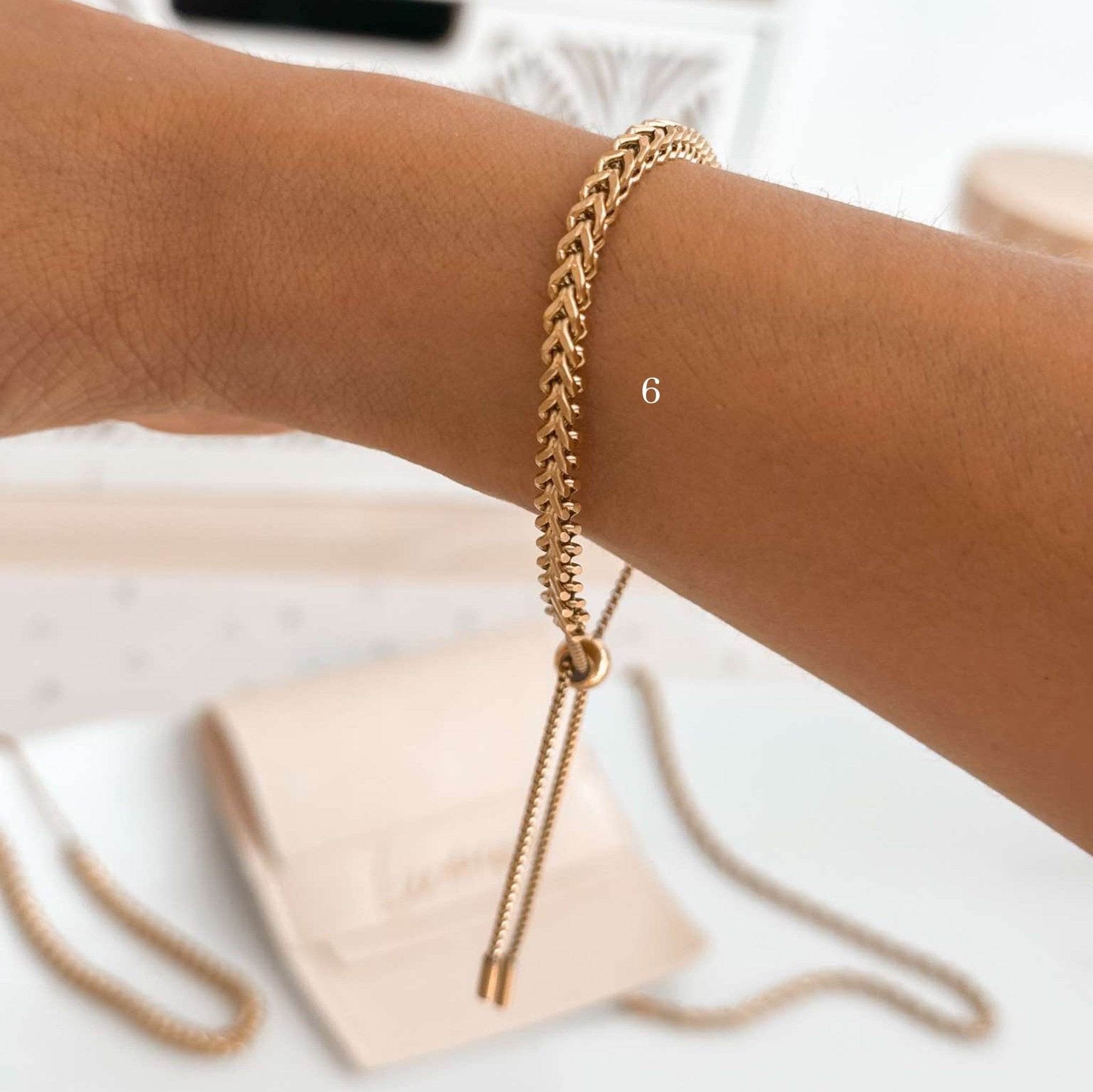 Twisted vintage-style bracelet with sliding closure and boho vibes.