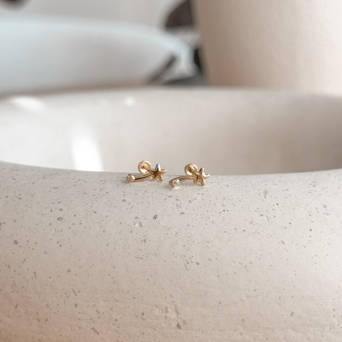 10K solid gold comet stud earrings with screw backs on a speckled stone dish – Liv Aura