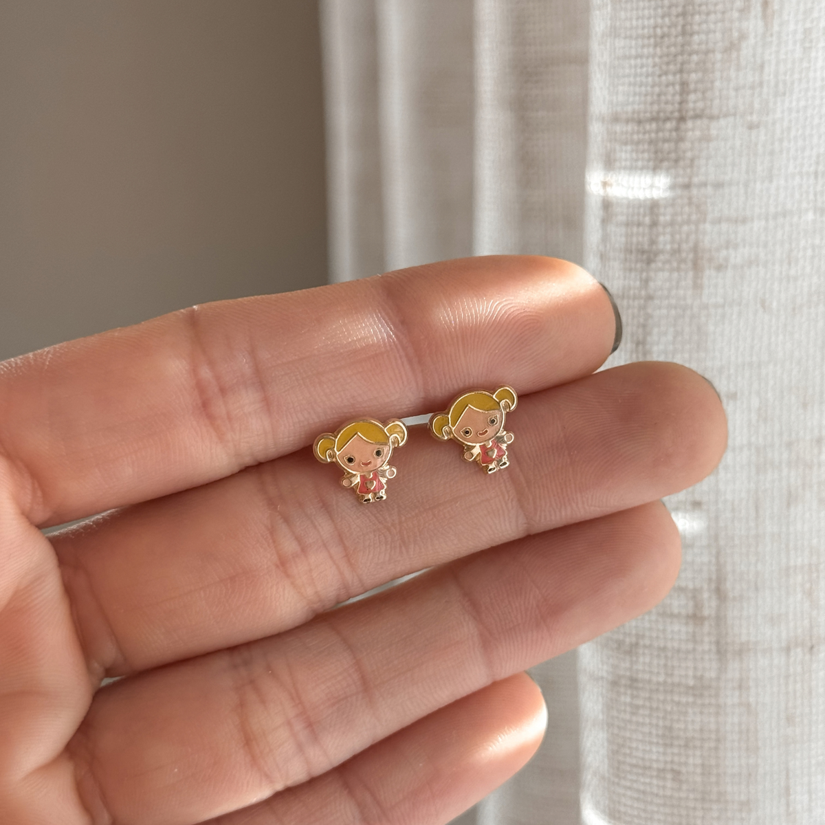 10K solid gold girl stud earrings with colorful enamel held in hand to show the size – Liv Aura