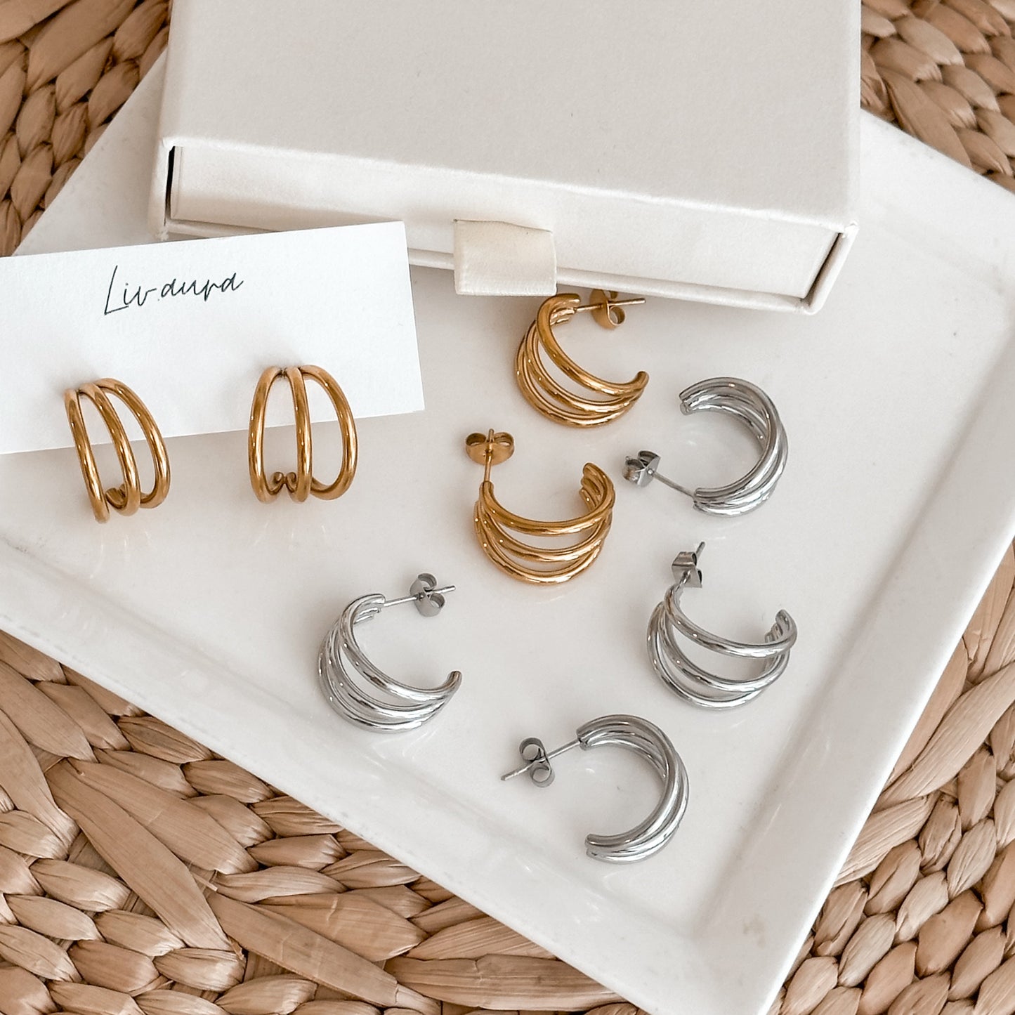 Mix of gold and silver triple hoop earrings on Liv Aura tray – elegant and gift-ready presentation