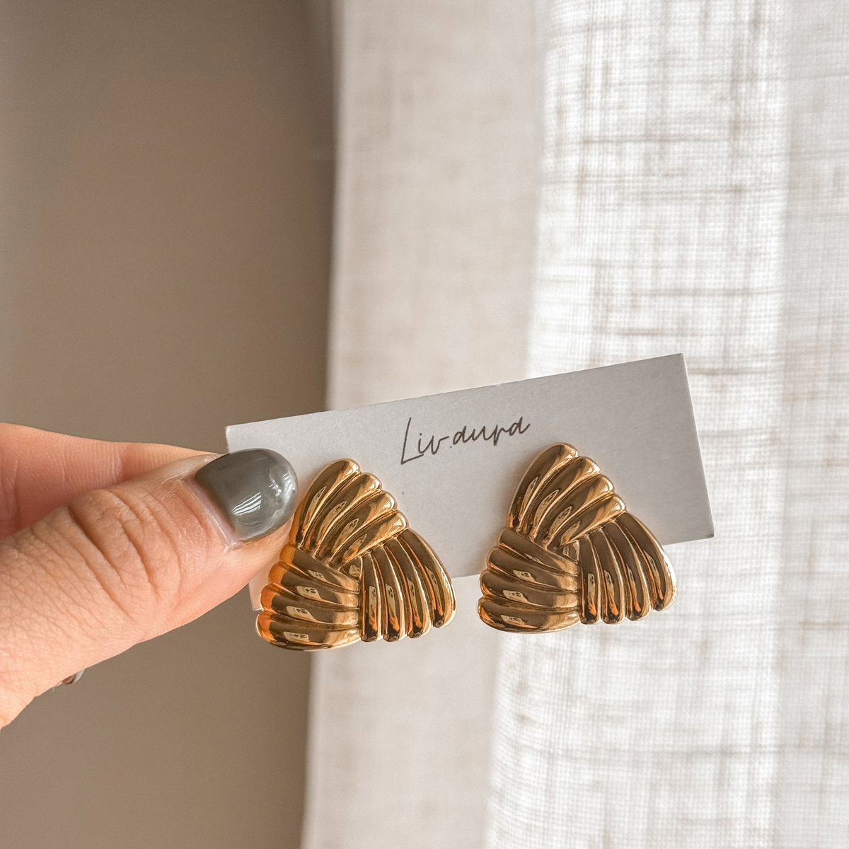 Gold ribbed triangle earrings held on a Liv Aura earring card – Liv Aura