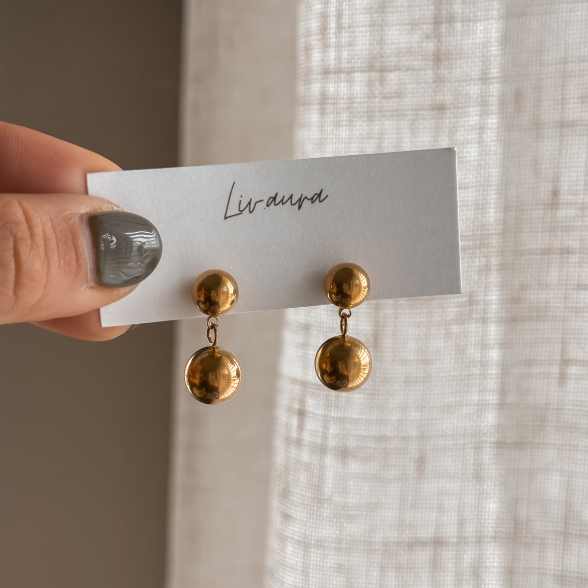 Gold double ball drop earrings on a Liv Aura earring card – Liv Aura