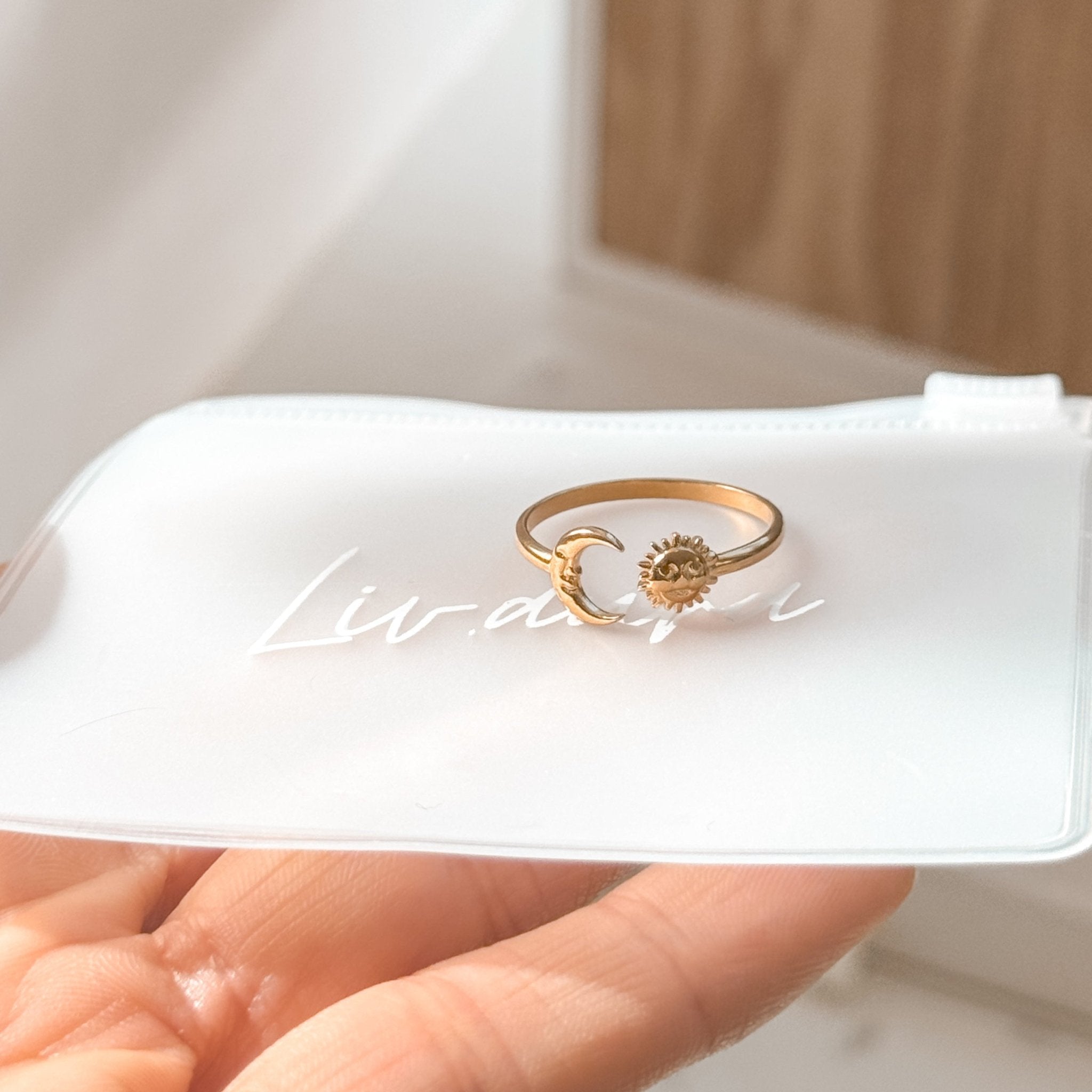 Adjustable sun and moon ring in its eco-friendly packaging.
