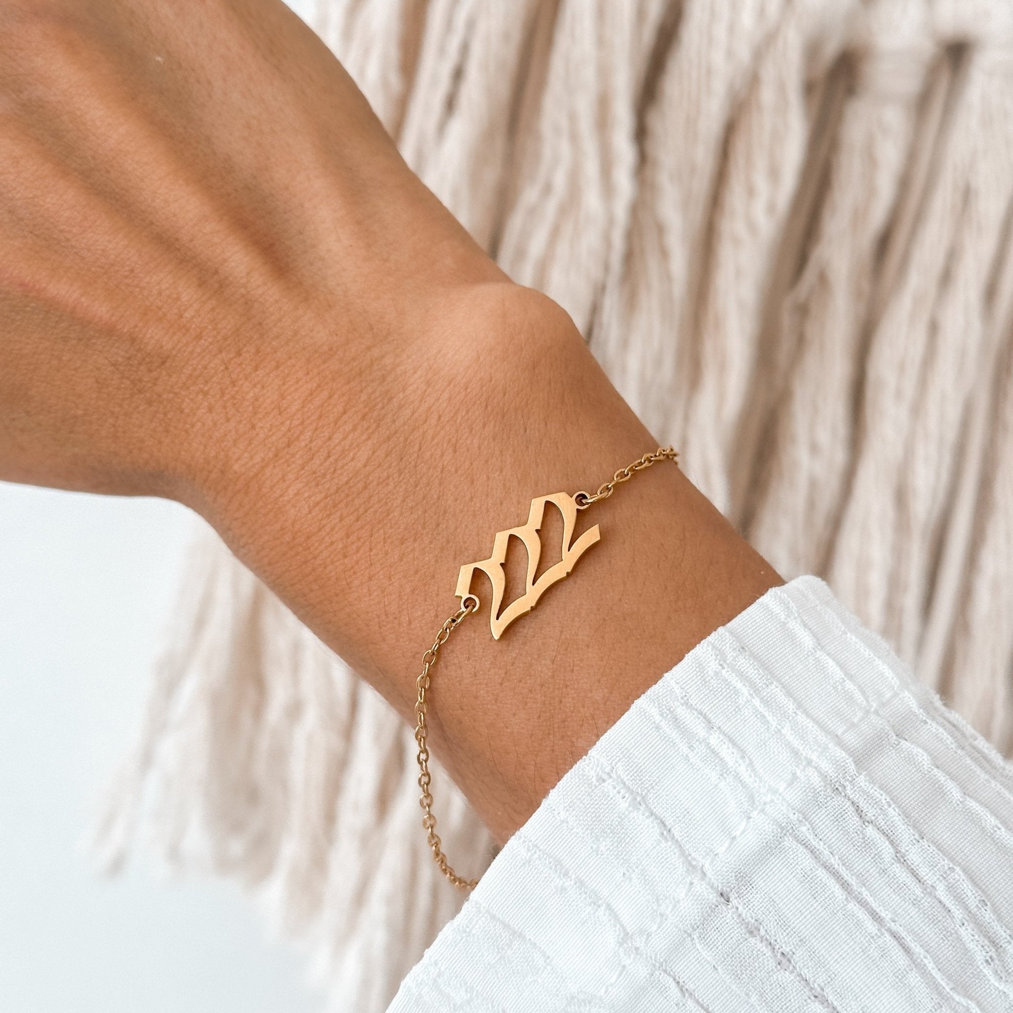 222 angel number bracelet worn on real wrist, close-up for detail