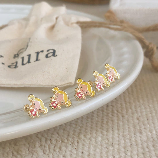 Load image into Gallery viewer, These little girl stud earrings are the perfect accessory for any age. These gold screw back earrings are 10K gold plated and have a little enameled girl in the center. 

