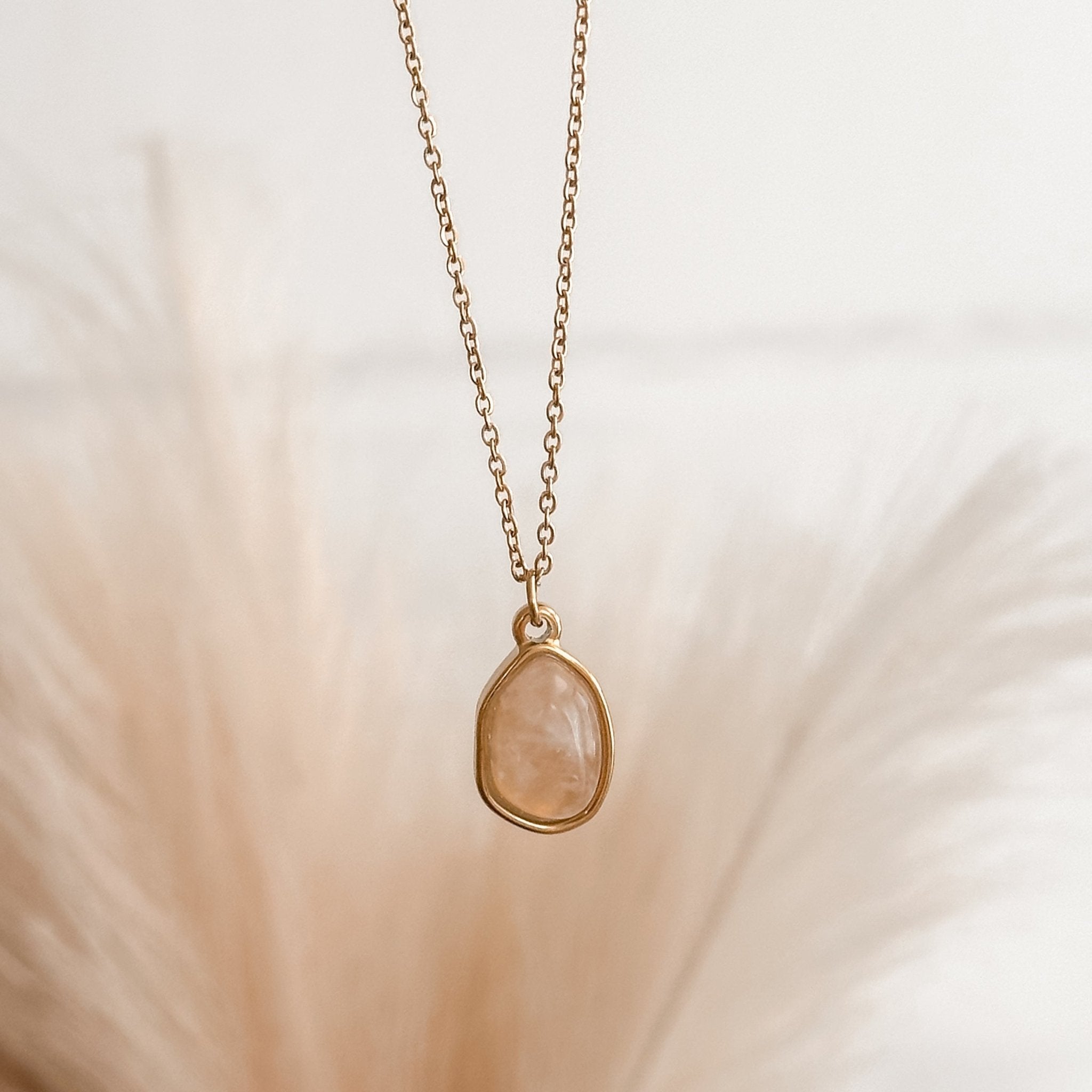 Delicate rose quartz healing tree necklace in 18K gold, waterproof and hypoallergenic.