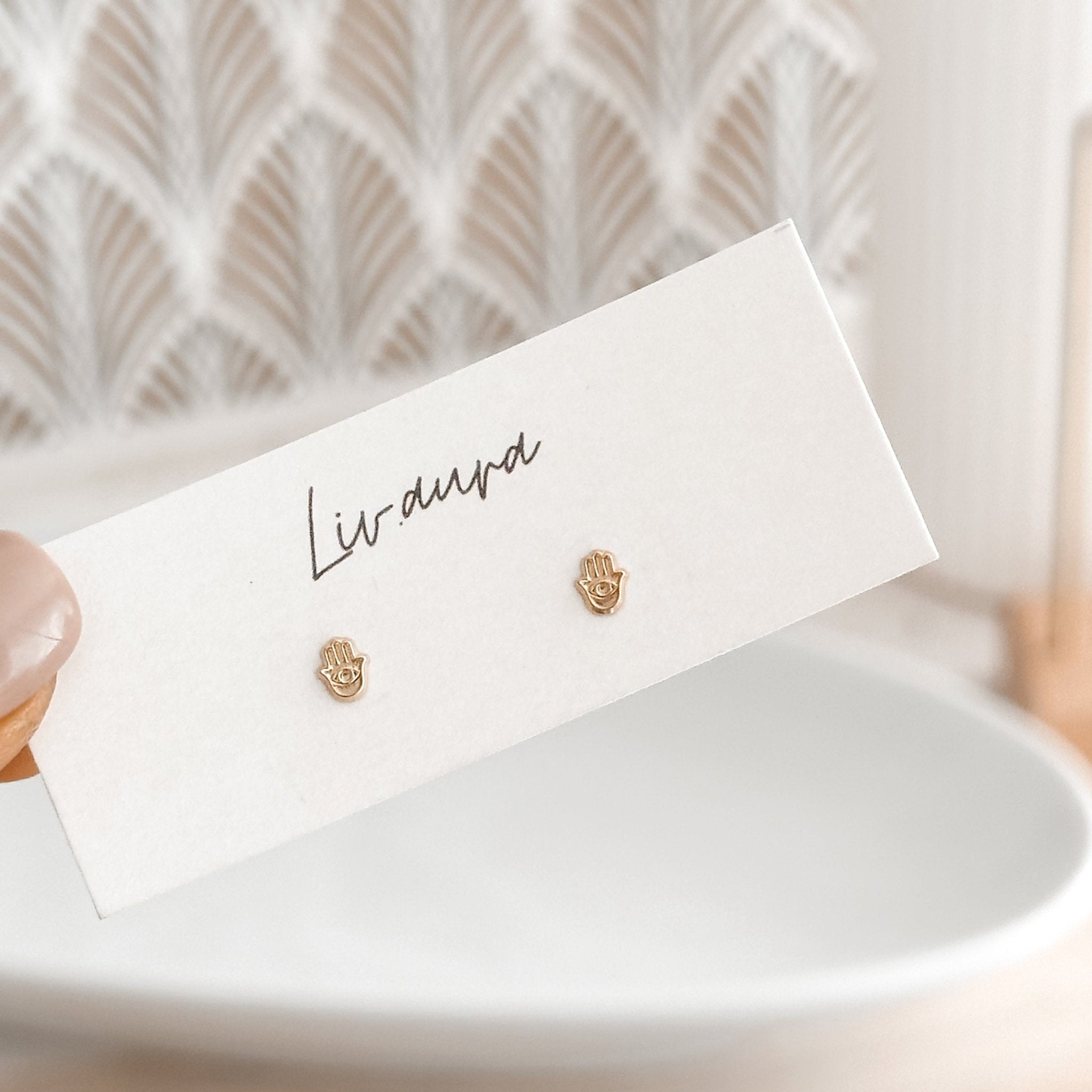 Mini Hamsa Hand studs on LivAura display card