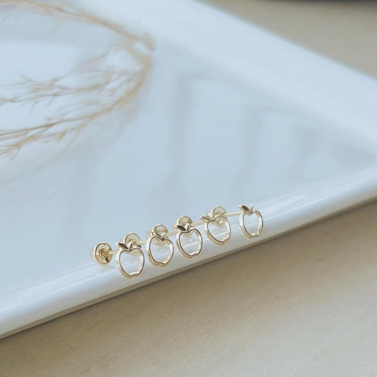 gold apple stud earrings