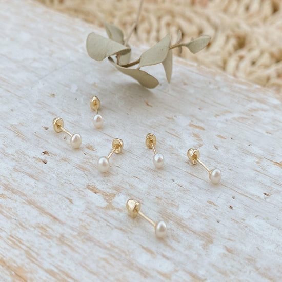 These simple pearl stud earrings are the perfect addition to any bridesmaids jewelry. The subtle gold adds elegance, while the timeless shape and size makes these affordable pearl earrings a timeless addition to your jewelry collection.