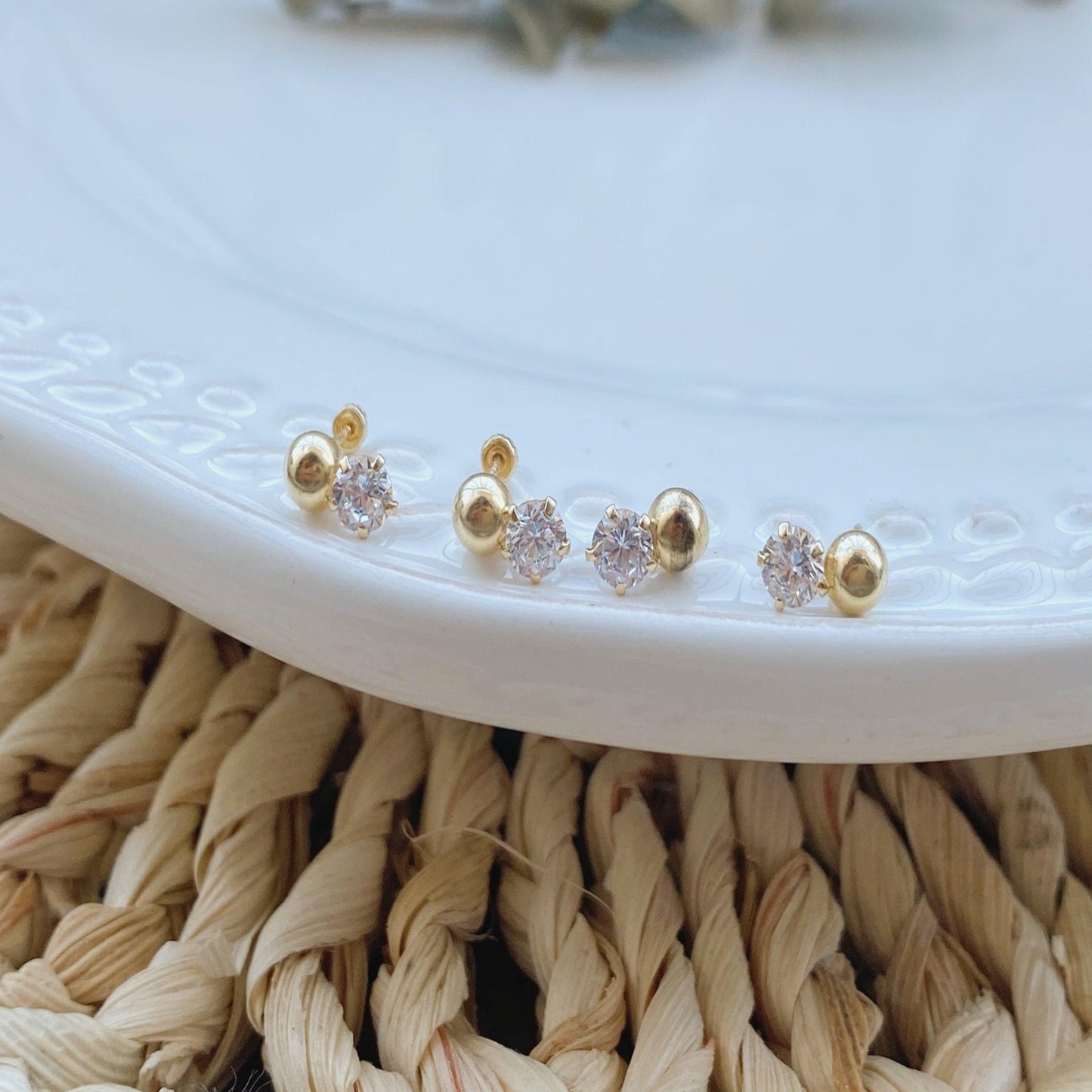 Simple and delicate, these post earrings are perfect for everyday wear. These stunning studs are crafted of 10K gold with a CZ drop and have screw backs for added security. The light weight design makes them comfortable to wear.