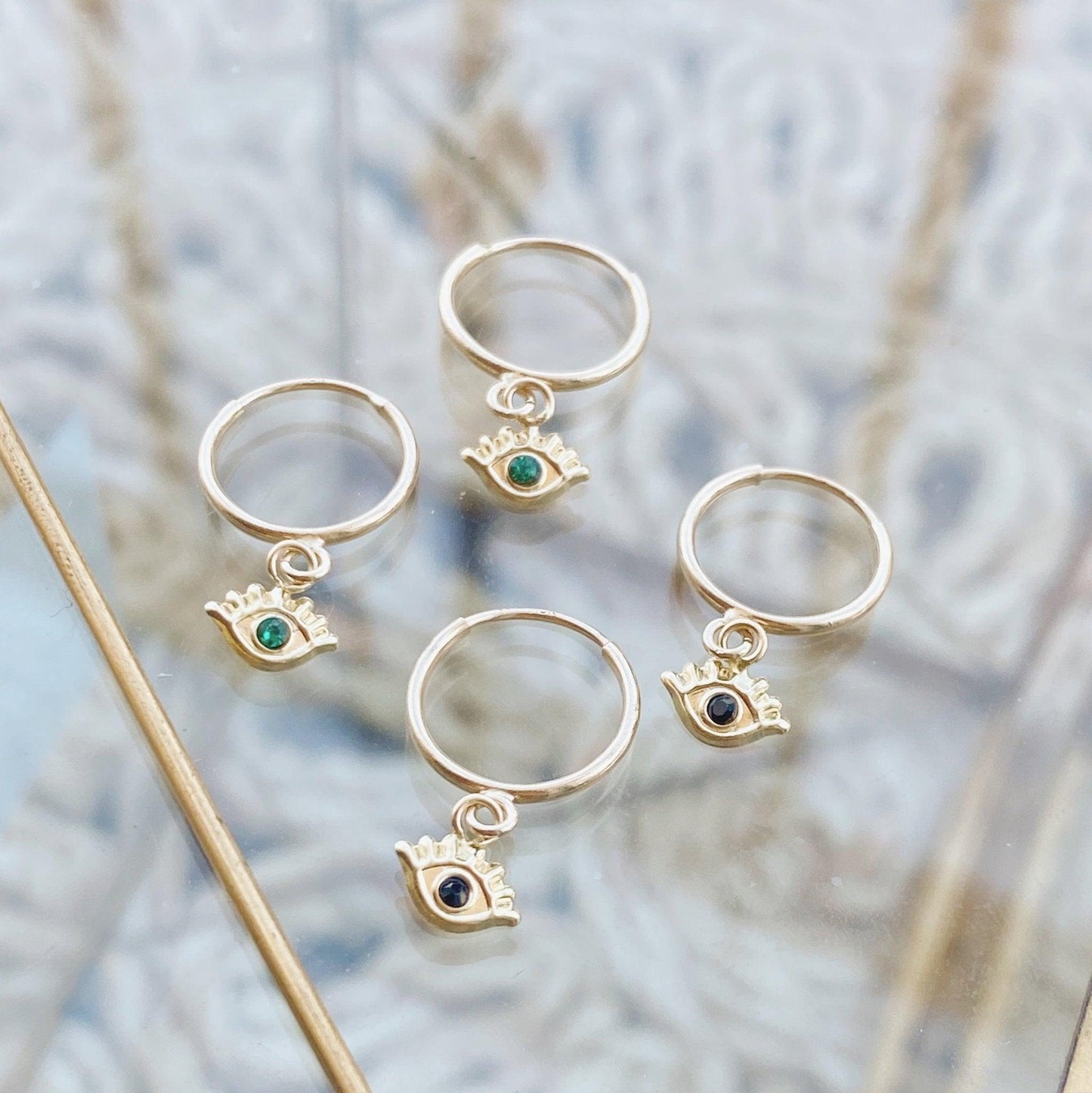 These versatile huggie hoops are delicate and perfect for stacking with other jewelry or wearing alone. They have a rounded back so they will not irritate your skin, unlike other cartilage earrings that have ridges. This makes them perfect for every day wear!