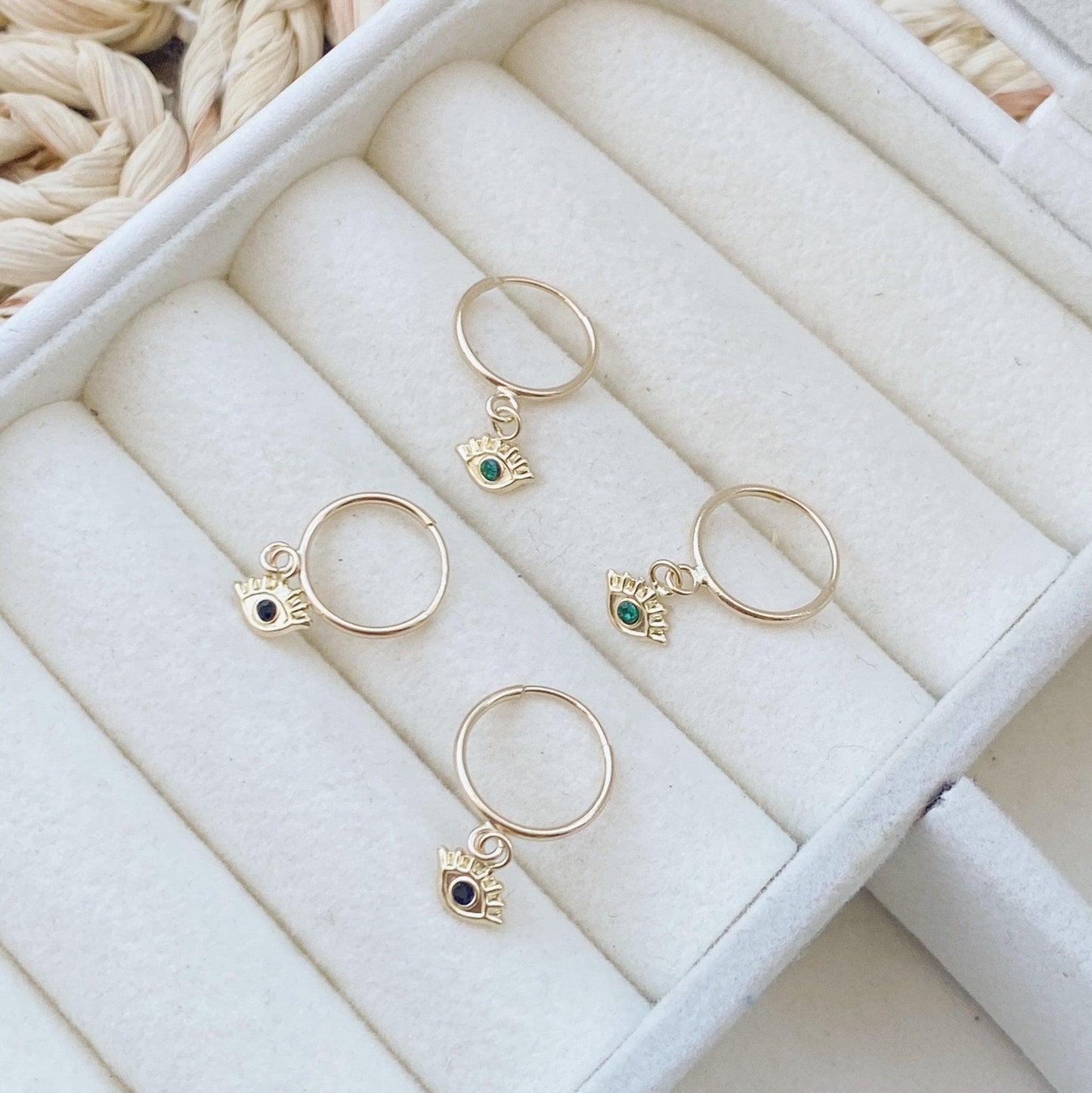 Looking for that perfect pair of gold evil eye hoops? This is it! These lightweight, 10K gold earrings are a perfect gift for yourself or someone you love. Perfect for everyday wear, the third eye hoops are great for classes, work or just running errands.