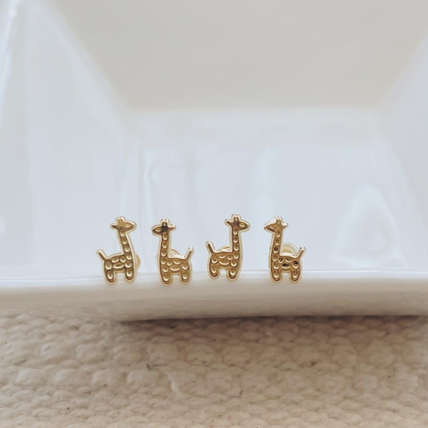 Load image into Gallery viewer, These giraffe earrings may be small and adorable, but they’re anything but flimsy! 
