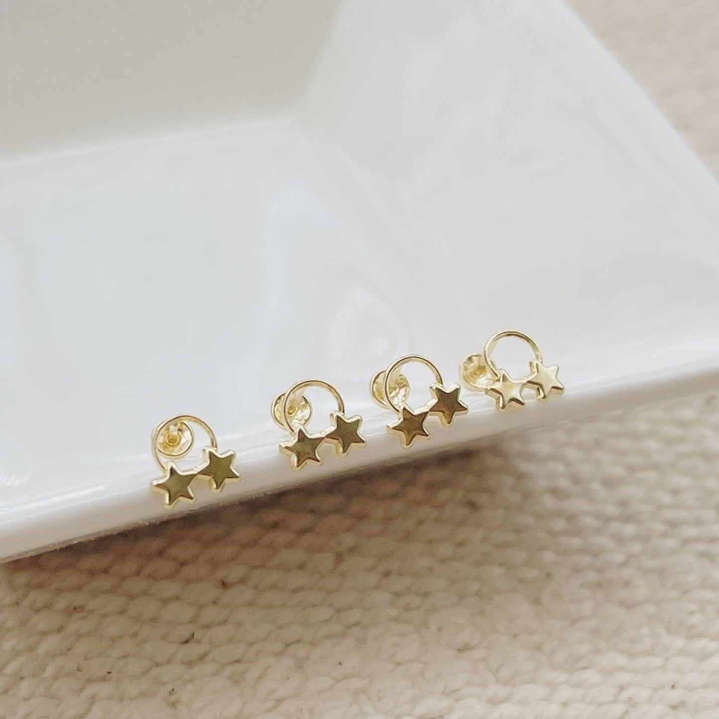 A gold stud earring for everyday wear, these modern circle stars are simple and classic. 