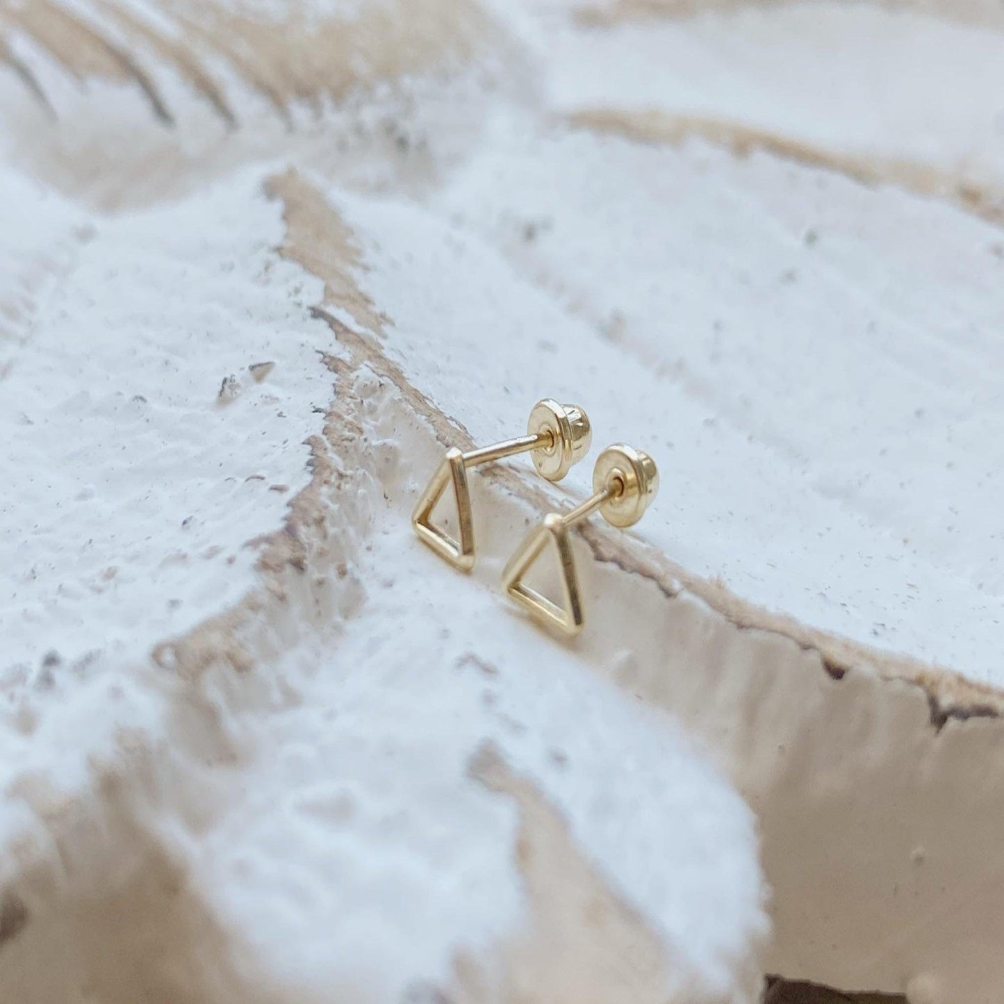 These triangle studs are a must have for your everyday earring collection. They are made from pure 10K gold and make a perfect minimalist statement.