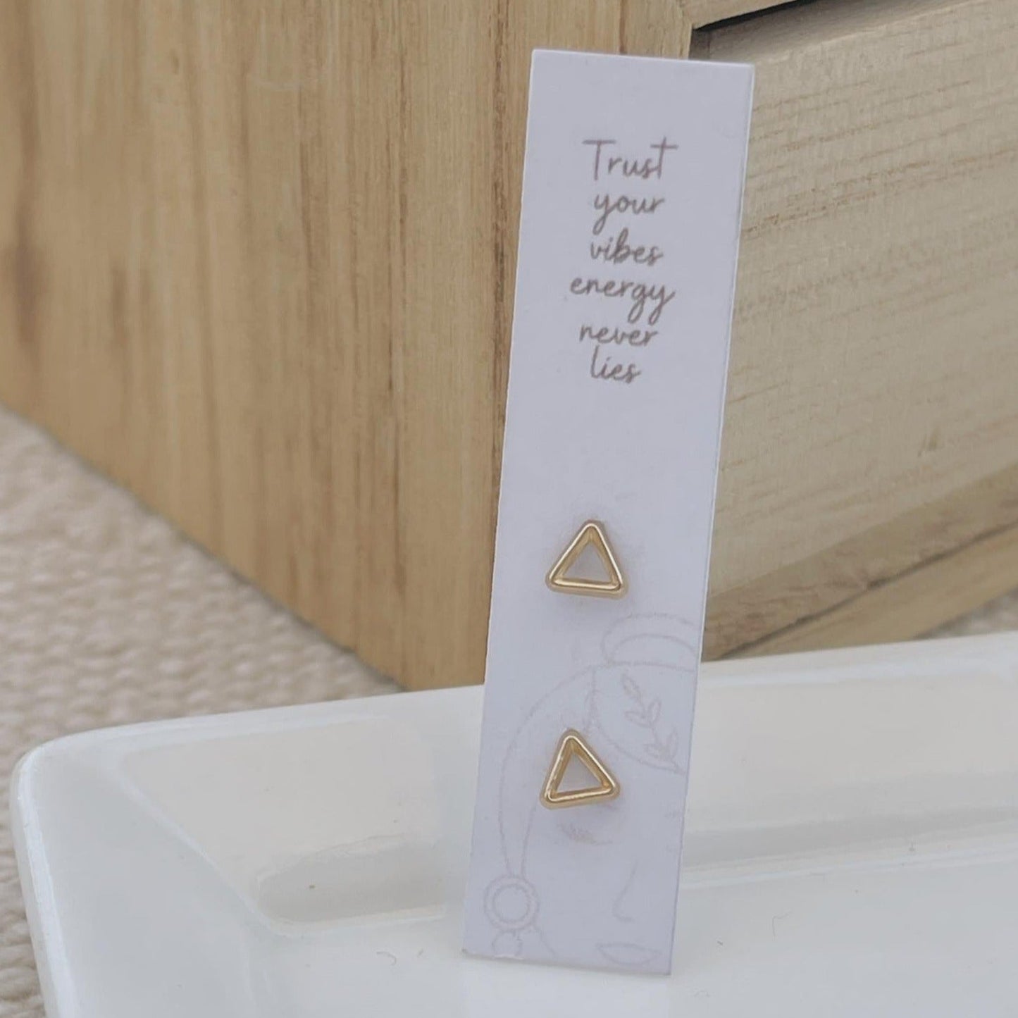 These delicate triangle studs are perfect for everyday. They are lightweight and made of 10K gold, so they won't irritate your ears. They can be worn with any outfit in any occasion and look great on everyone. These trendy geometric earrings make a great gift!ear stack