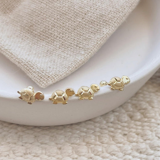 Load image into Gallery viewer, 10k gold animal stud earrings with gold screw backs 
