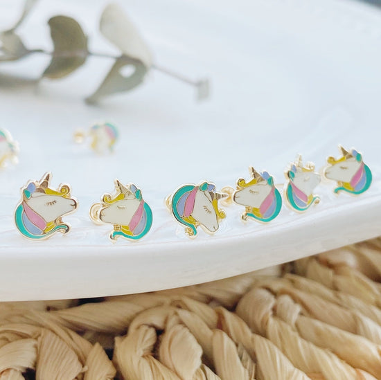 Fashionable and adorable, these unicorn earrings are the perfect gift for your little girl. A rainbow colored unicorn adorns each of these screw back hoops, with a gold finish that adds just the right amount of sparkle!