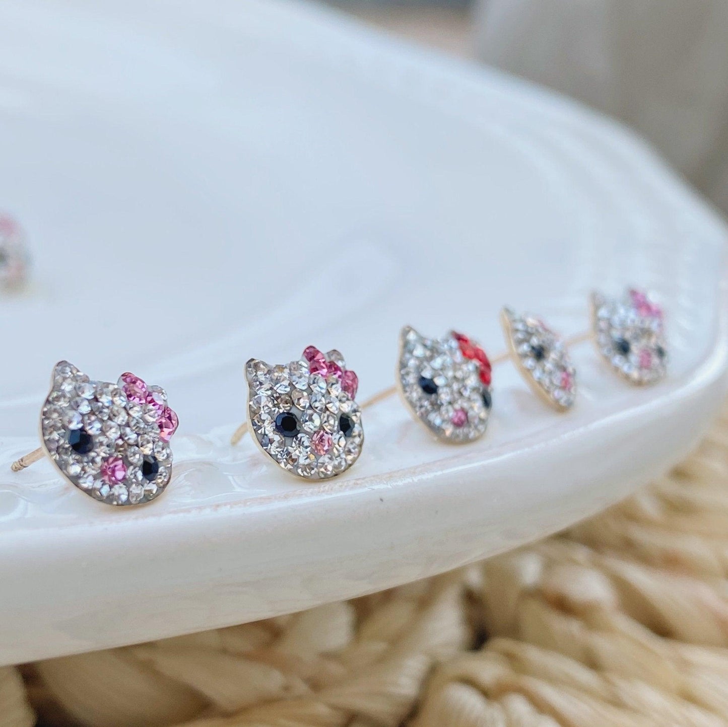 Hello Kitty inspired gold earrings are perfect for every occasion and will add a touch of style to any ears. These adorable round stud earrings are not only a fun statement but they also look great! The screw back closure makes them safe for use by young girls who like to wear earrings.
