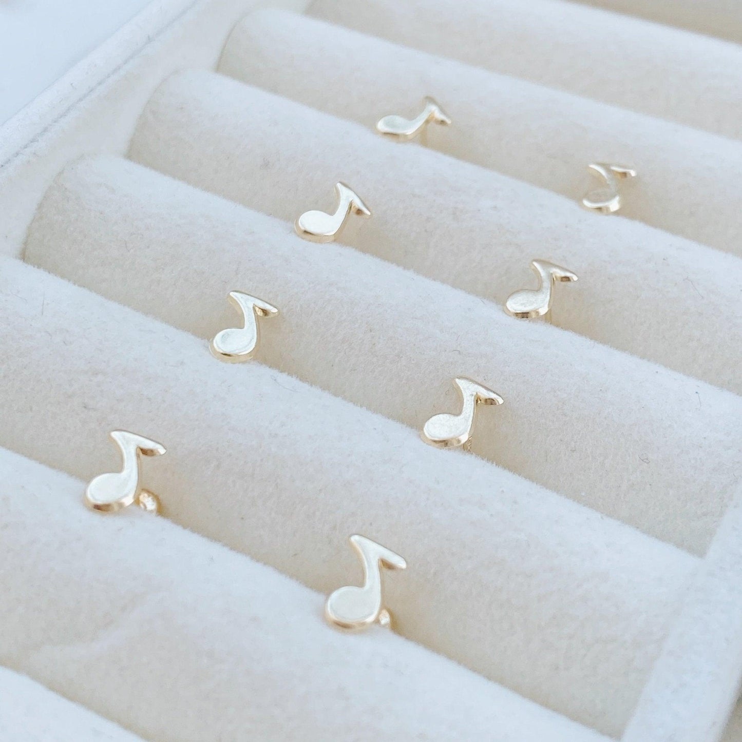 Load image into Gallery viewer, Dress up your ear with these Music Note Earrings. Featuring gold music note studs, they are the perfect gift for any music lover! These earrings feature a minimal design to make them appropriate for everyday wear.
