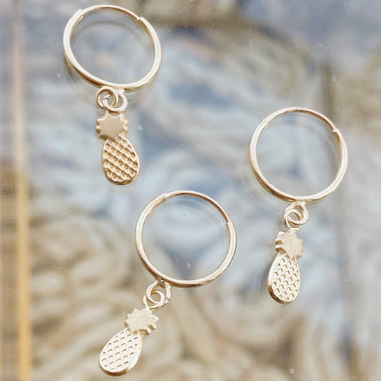Load image into Gallery viewer, These 10K Gold Hoop Earrings are the perfect addition to any outfit! They will definitely make a statement, and let you express yourself in a fun and unique way.  They&amp;#39;re also lightweight, making them super comfortable to wear. If you want to give your style a tropical touch with a touch of gold, these earrings are for you!
