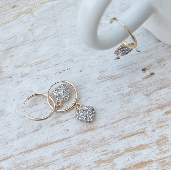 This pair of 10k gold heart huggie hoops is a great way to show your love, or just add some flare to your look! These small hoops are perfect for everyday wear and would make a wonderful Valentines Day Gift!