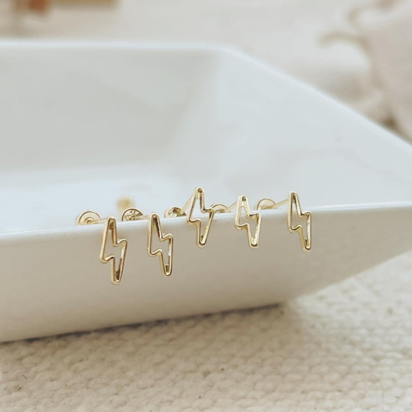 Lightning Bolt Earrings are inspired by the power and beauty of the lightning bolt. These minimalist earrings will add a celestial touch to your outfit and elevate your look