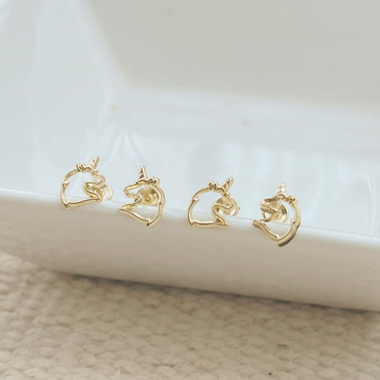 Load image into Gallery viewer, Our Gold Unicorns Earrings are the perfect gift for girls. These gold unicorn stud earrings have a screw backing 
