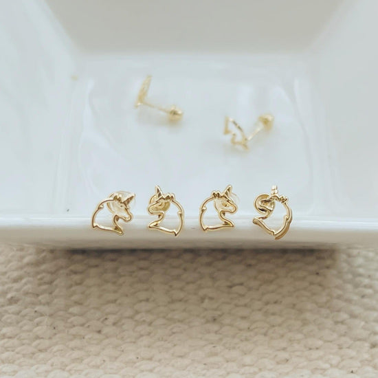 Load image into Gallery viewer, These magical unicorn earrings make a perfect gift for kids and adults alike. These sweet little gold yellow gold earrings feature a unicorn silhouette.The screw back is a great fit for all ages - kids, teens and adults!The backings are hypoallergenic and won&amp;#39;t irritate sensitive skin.
