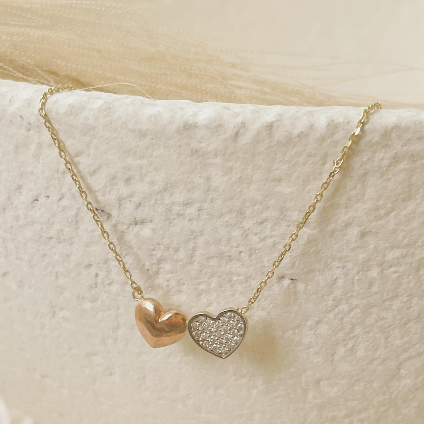 Load image into Gallery viewer, This is a double heart 10K gold pendant necklace. It is simple and delicate enough to add some charm and bling to any outfit. This love necklace can be used as a gift to your special one or just wear it on your special days.
