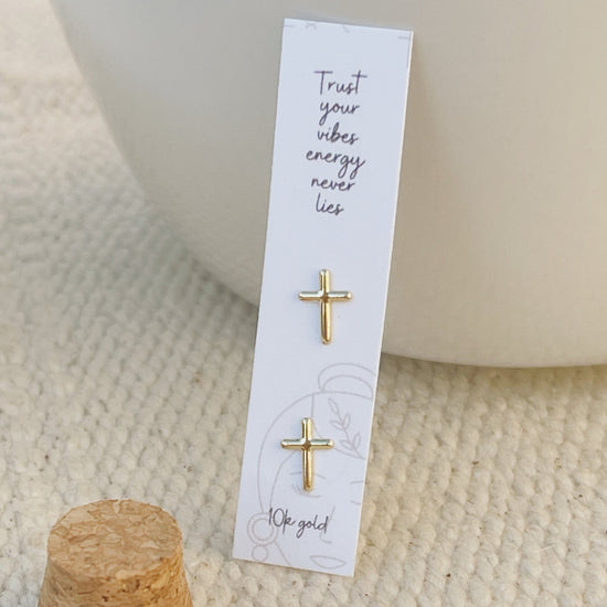 Delicate gold cross earrings displayed on faith-themed card, 10K solid gold studs