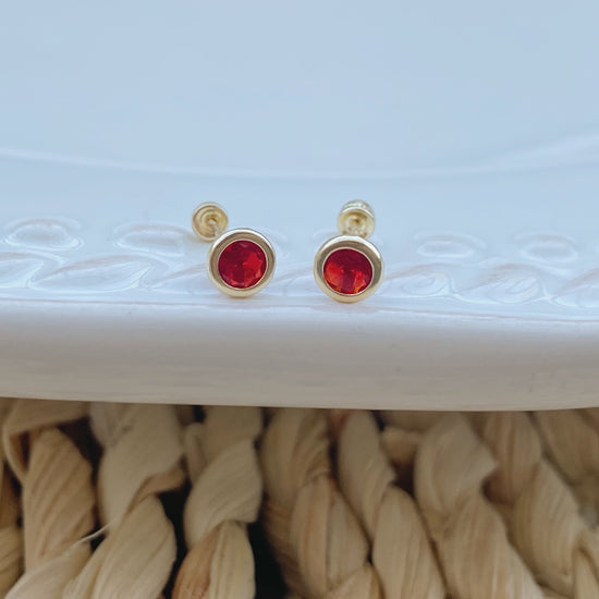 These 14k solid gold bezel stud earrings have a 4mm bezel and are perfect for both men and women. 