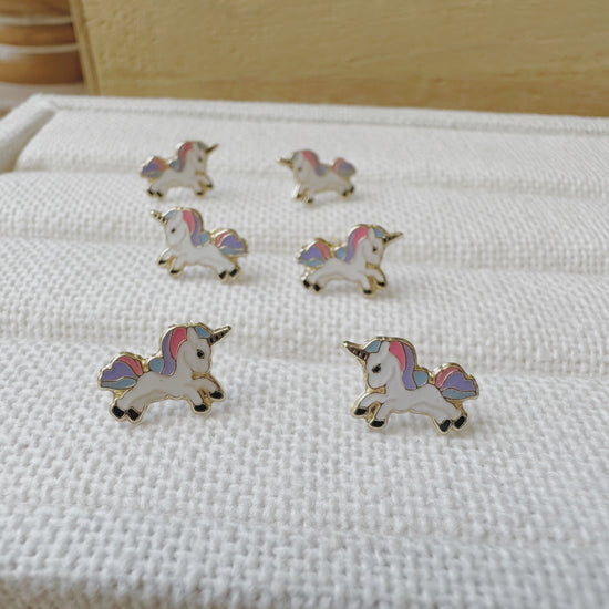 Load image into Gallery viewer, These beautiful gold enamel earrings are perfect for any unicorn lover. These make great gift ideas, birthday presents, or just to treat yourself. 
