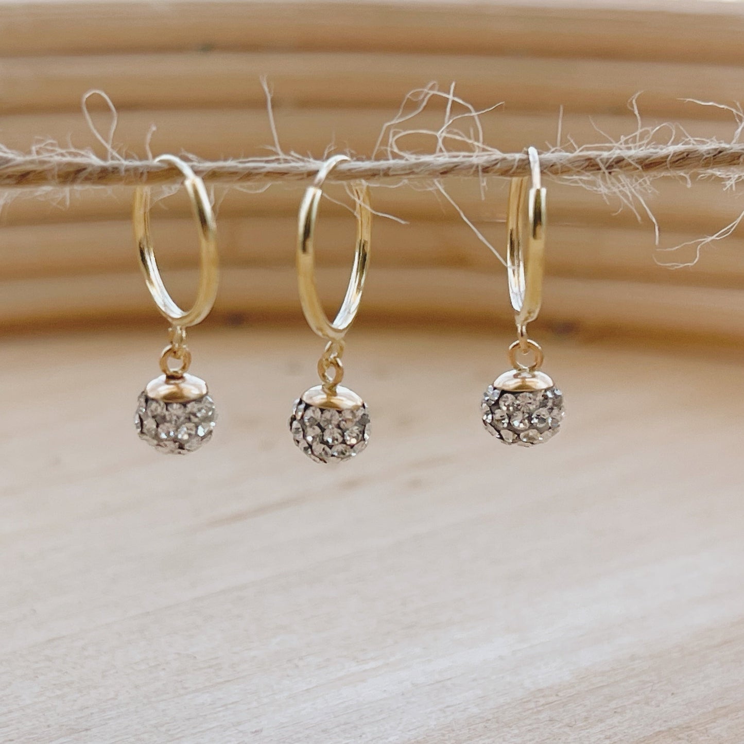 These gold hoop earrings are the perfect minimalist hoop earrings. The sphere shaped hoop is simple, yet eye catching. 