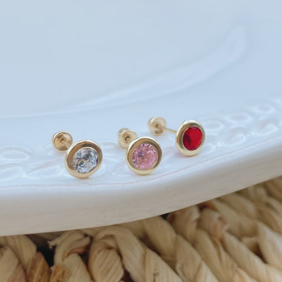 These beautiful bezel stud earrings are made of solid 14K gold and have 4mm bezels. They have screw backs for added security, making these very comfortable to wear. These are perfect for anyone who wants a little sparkle in their life!