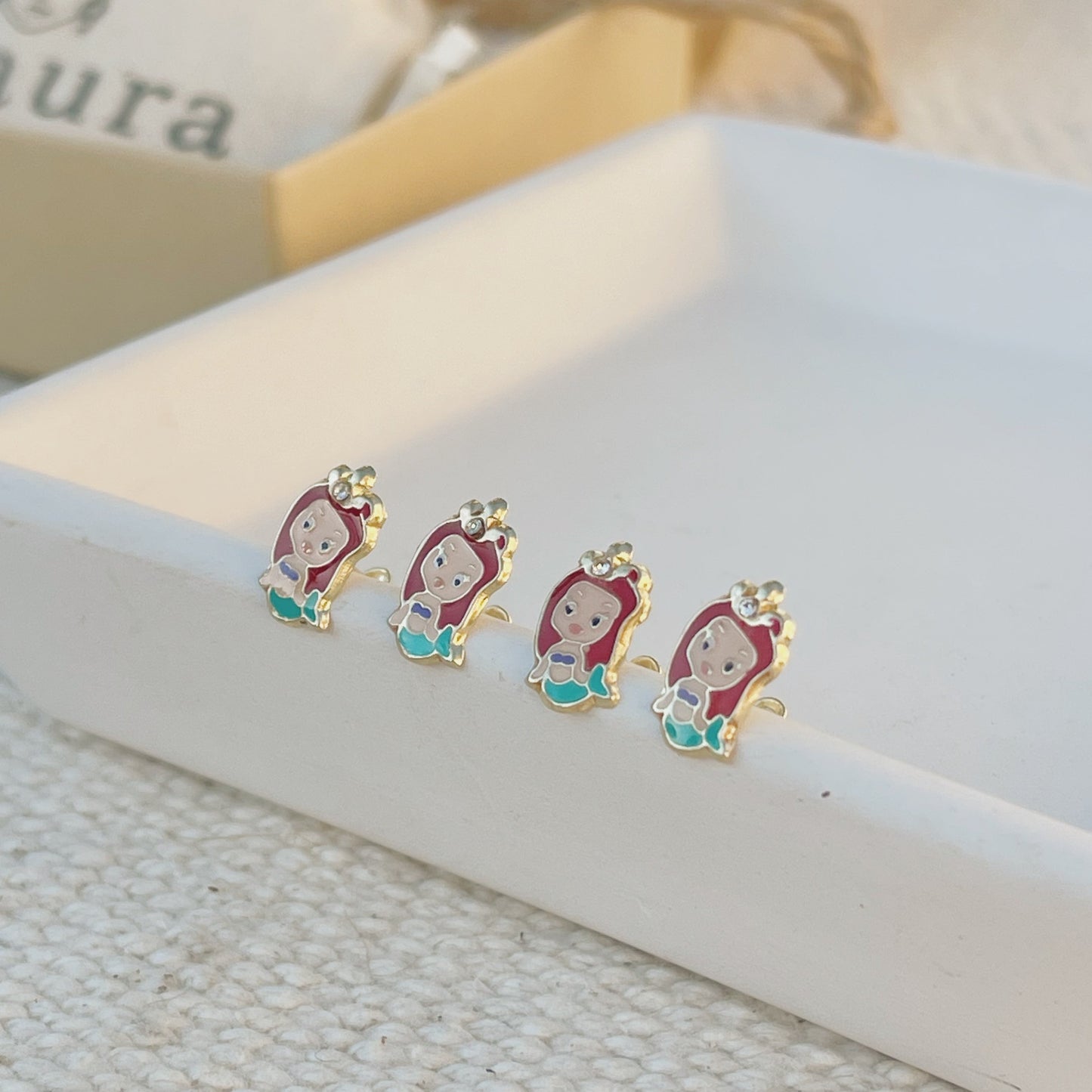 These 10K Gold Princess Earrings are the perfect gift for little girls who love the Little Mermaid. Inspired by Ariel, these earrings are sure to make every little girl feel like a princess